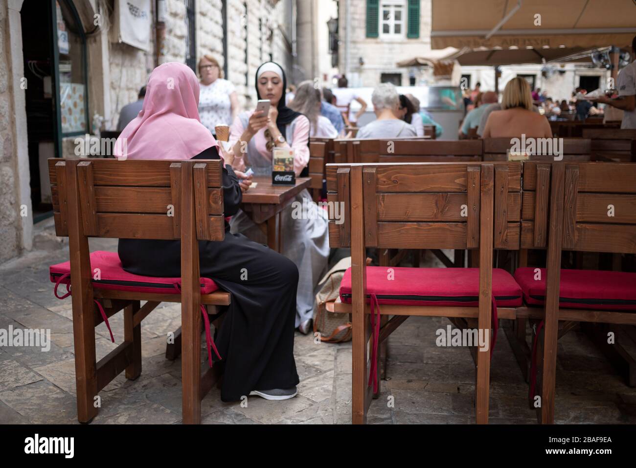 Montenegro, Sep 17, 2019: Outdoor cafe with guests in Kotor Old Town Stock Photo