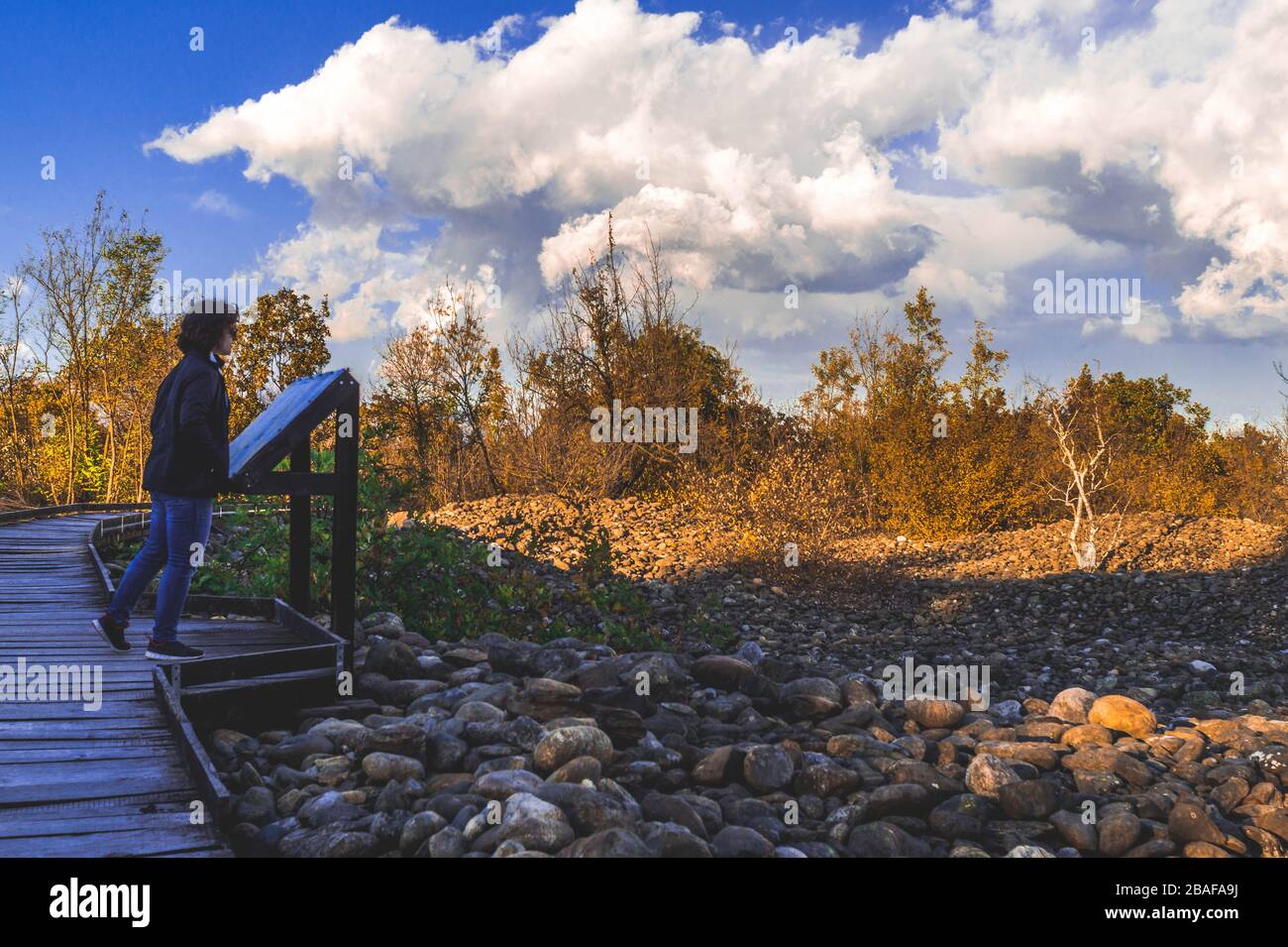 Woman leaning on rocks hi-res stock photography and images - Alamy