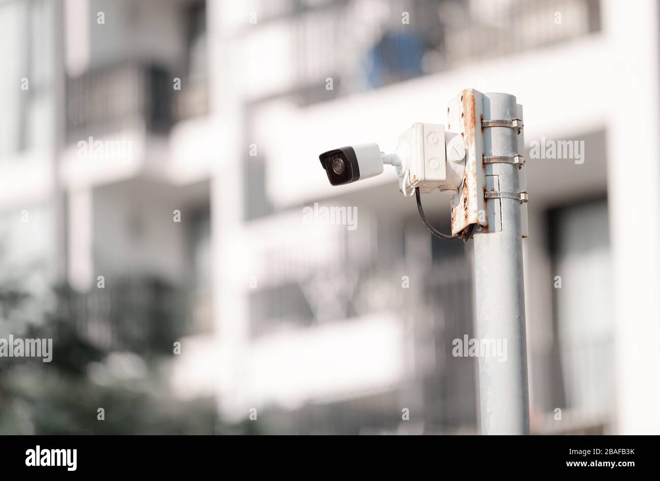 Security CCTV camera on pole in condominium building, Security camera concept Stock Photo