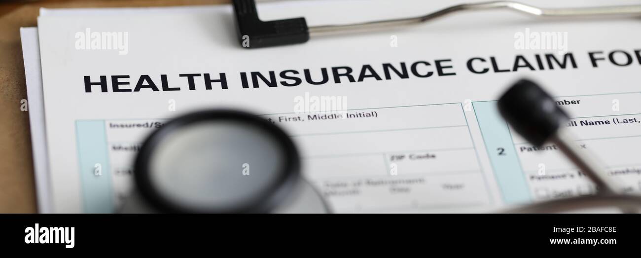 Filling out document health insurance claim form Stock Photo Alamy