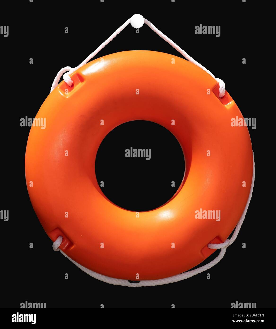 Orange lifebuoy isolated, attached on the wall. Maritime lifeguard equipment. Stock Photo
