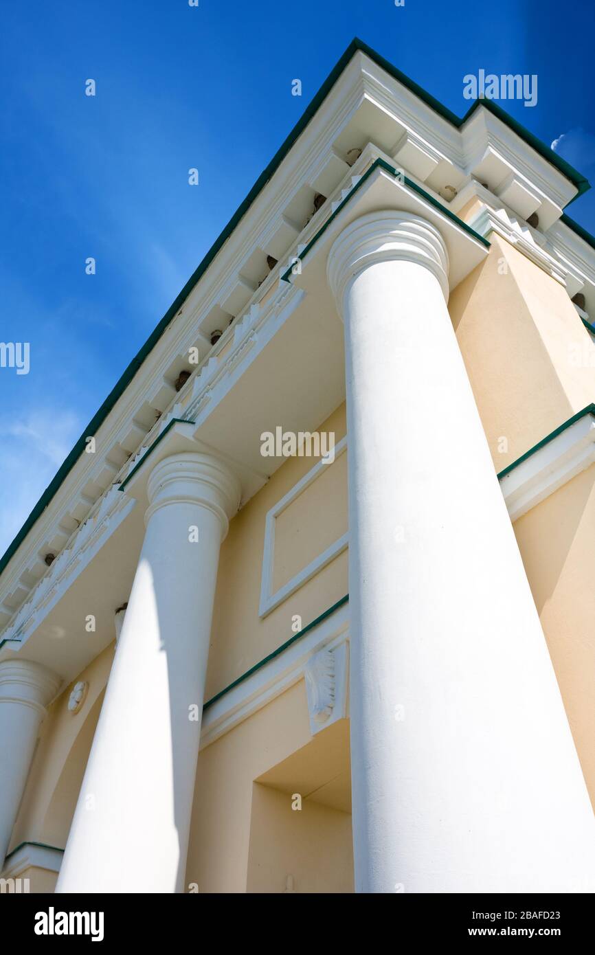 columns on blue sky background Stock Photo - Alamy