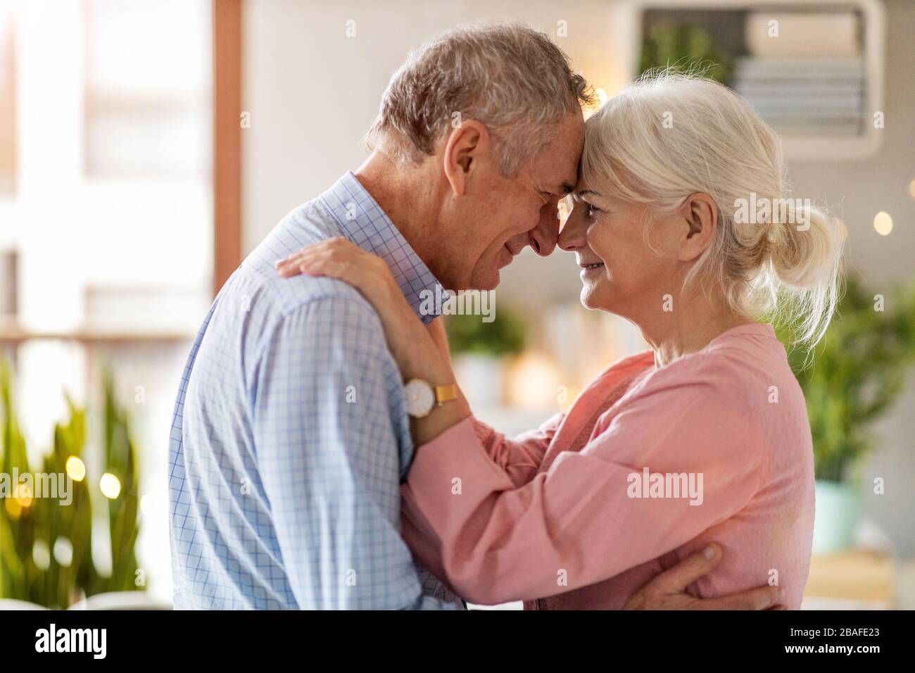 Portrait of a happy senior couple relaxing together at home Stock Photo ...