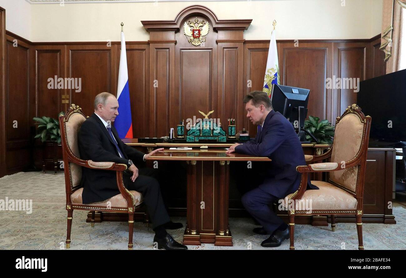 Moscow, Russia. 27th Mar, 2020. Russian President Vladimir Putin holds a working meeting with Gazprom CEO Alexei Miller at the Kremlin March 27, 2020 in Moscow, Russia. Credit: Mikhail Klimentyev/Kremlin Pool/Alamy Live News Stock Photo