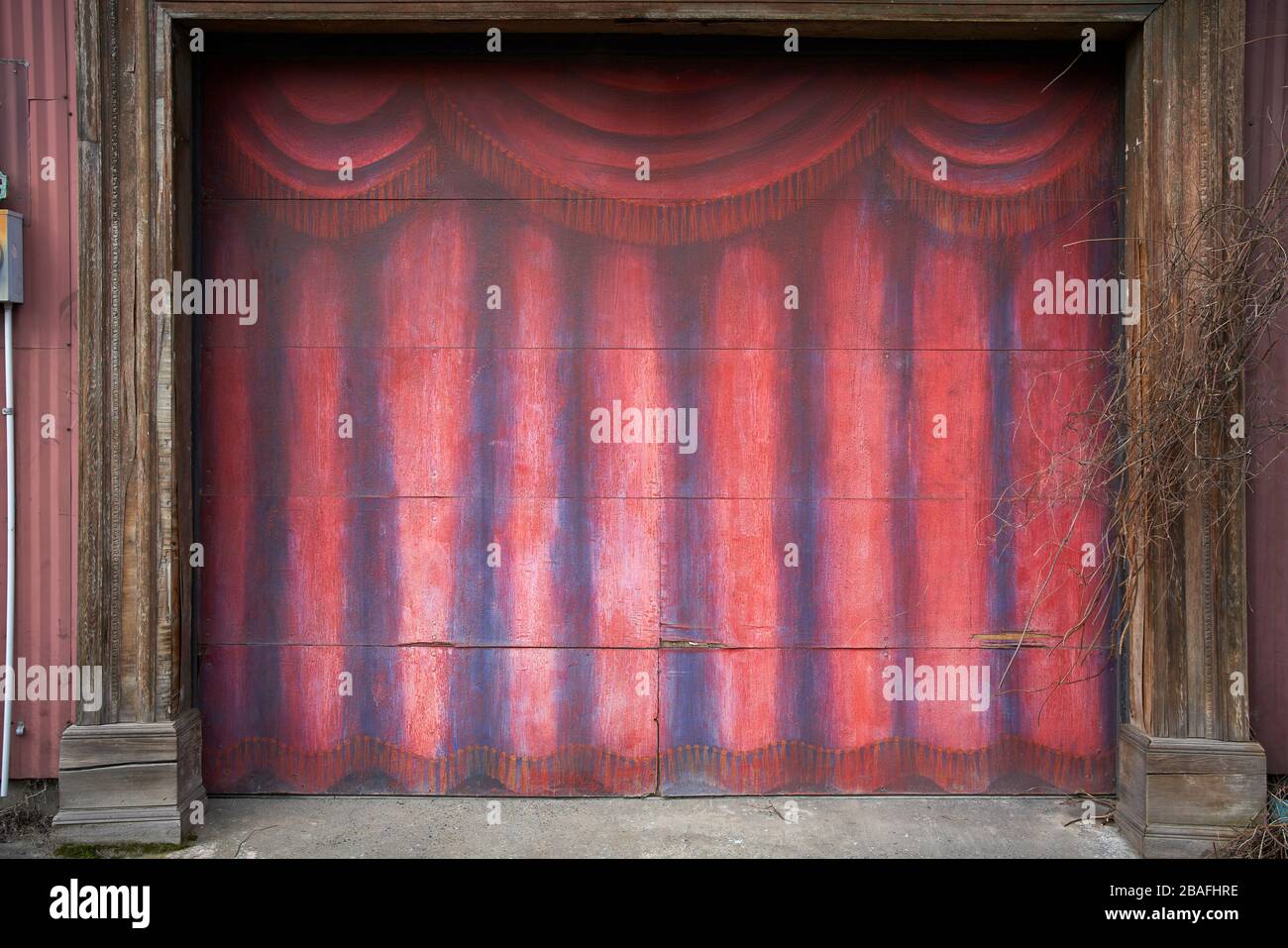 garage door decorated as theatre stage curtain Stock Photo