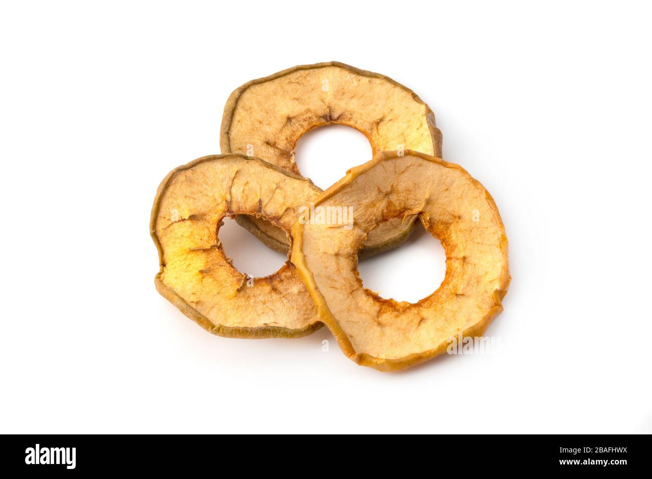Oven dried crispy yellow apples on a white background Stock Photo