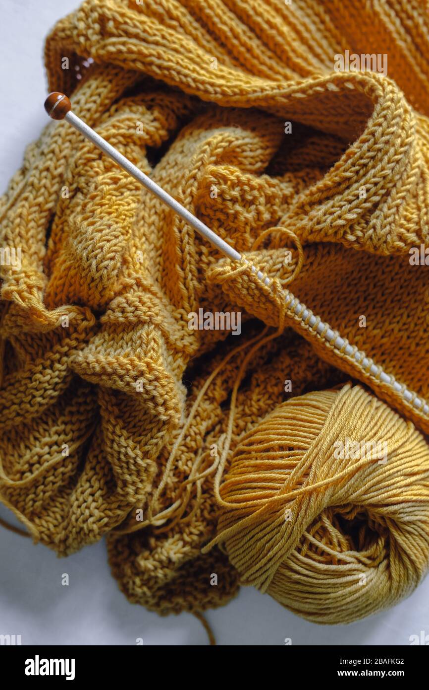 Yellow knitting yarn ball with needles Stock Photo Alamy