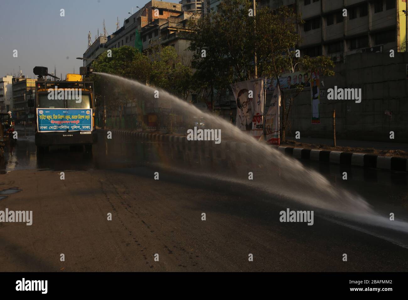 Dhaka Metropolitan Police is spraying disinfectant to the streets of Dhaka city to keep the city clean and prevent COVID-19 from spreading. Total 44 people have been infected by Covid-19 in Bangladesh, of whom 5 died confirmed by IEDCR. (Photo by Md. Rakibul Hasan/Pacific Press) Stock Photo