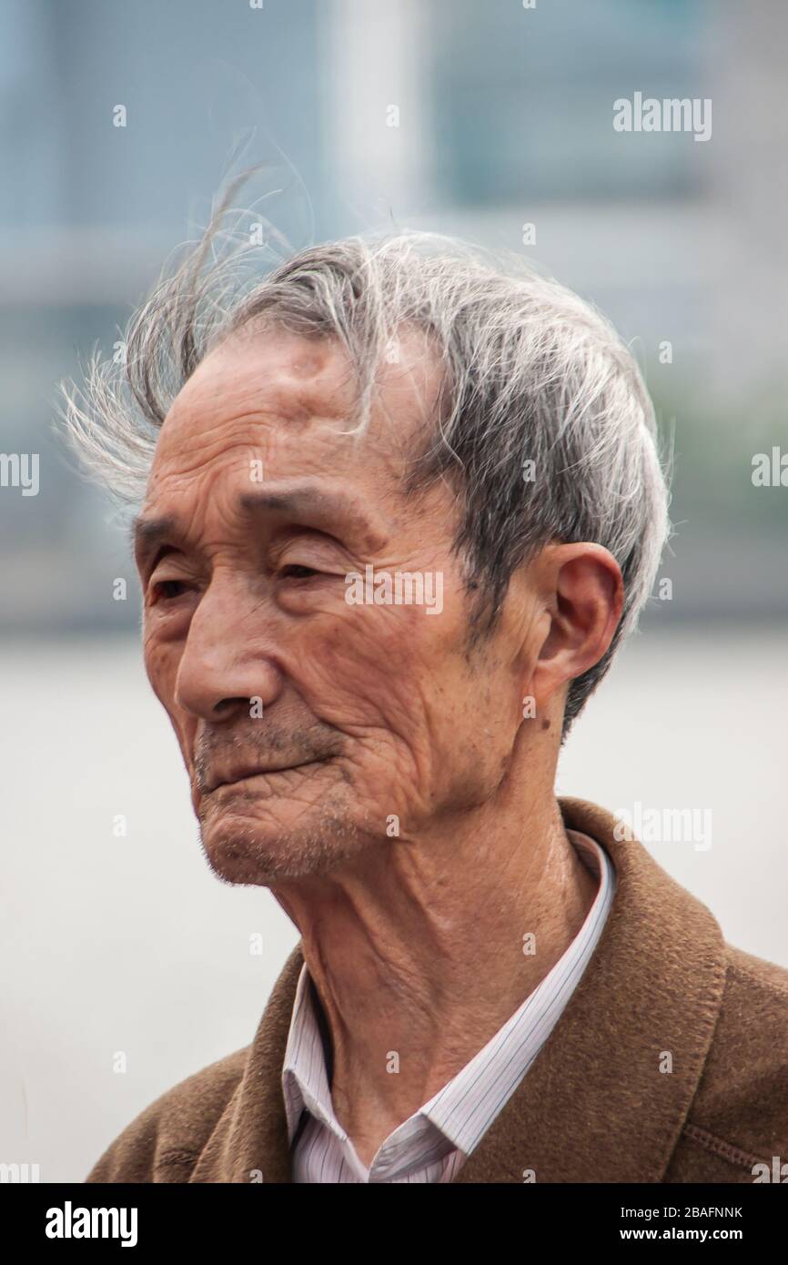 old man face neck  Shanghai, China - May 4, 2010: Closeup of face of older graying senior man  with cloths featuring white and brown around neck Stock Photo - Alamy