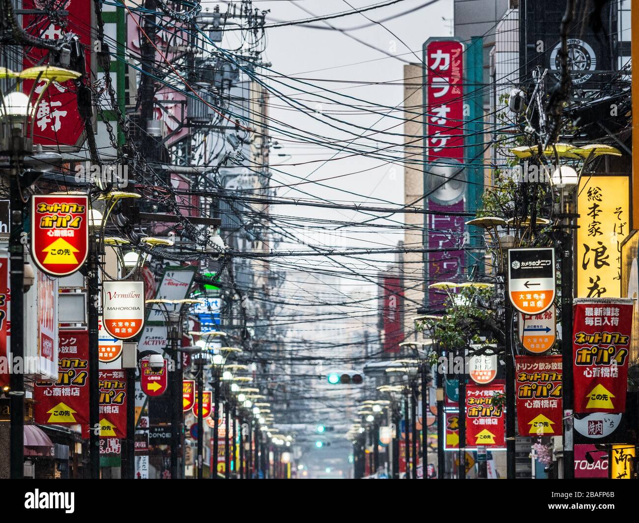 Osaka Japan Congested overhead cables in a street in Osaka Japan. Unlike most advanced nations the majority of Japan’s power grid remains above ground Stock Photo