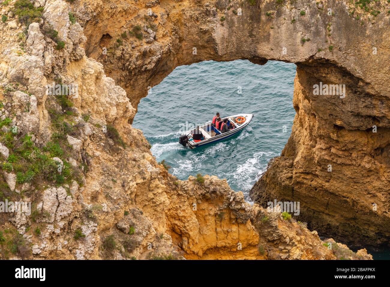 Lagos, Portugal - 4 March 2020: Tourists visiting Ponta da Piedade on a boat Stock Photo