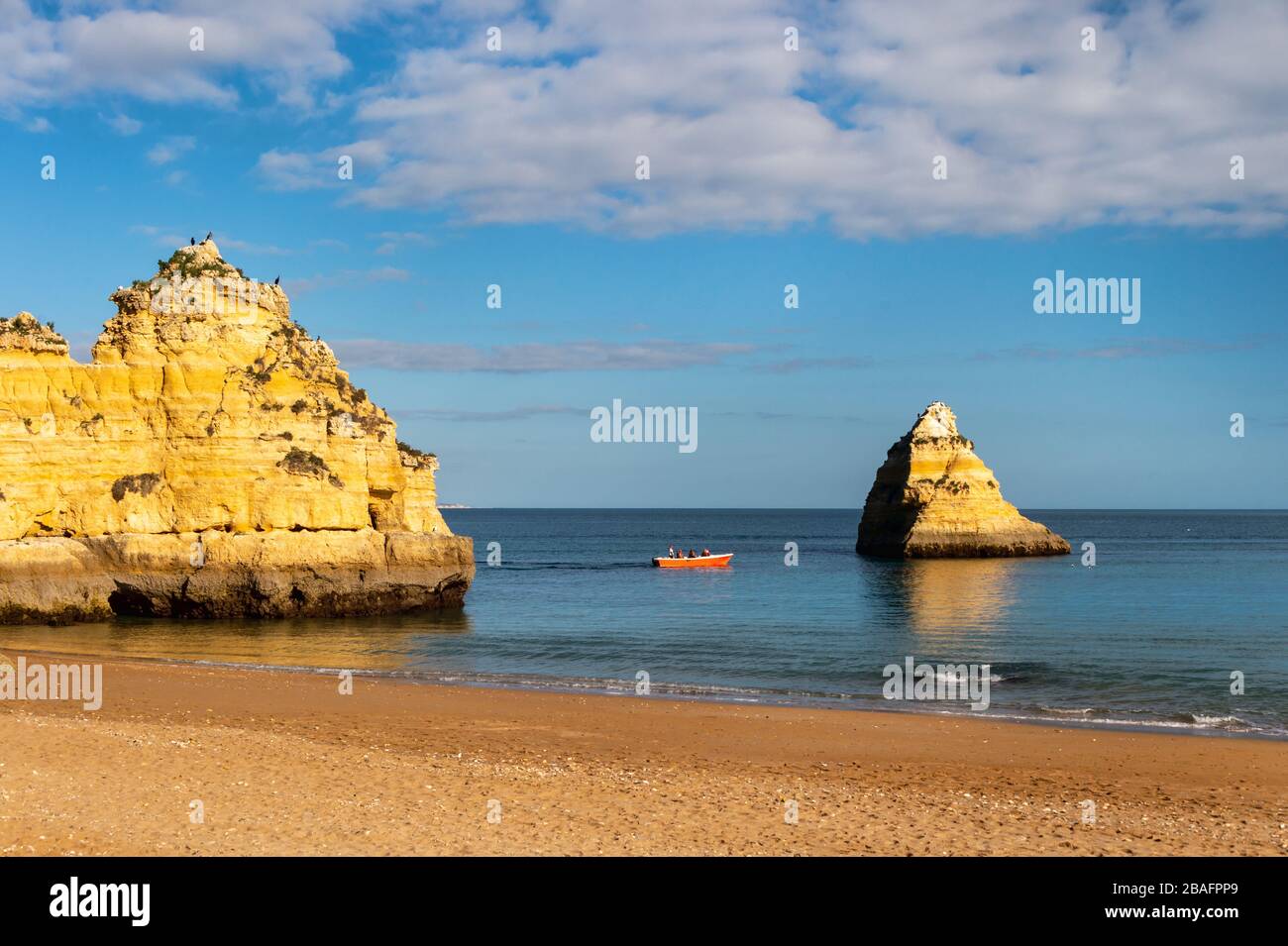 Lagos, Portugal - 4 March 2020: Lagos coastline in Portugal, Dona Ana Beach at sunset Stock Photo