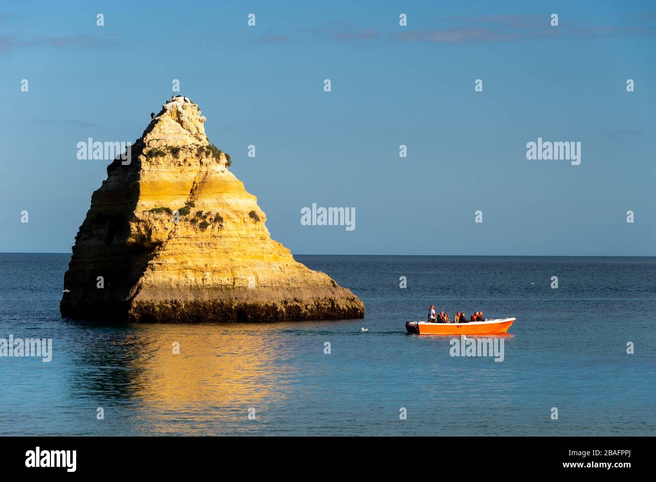 Lagos, Portugal - 4 March 2020: Lagos coastline in Portugal, Dona Ana Beach at sunset Stock Photo