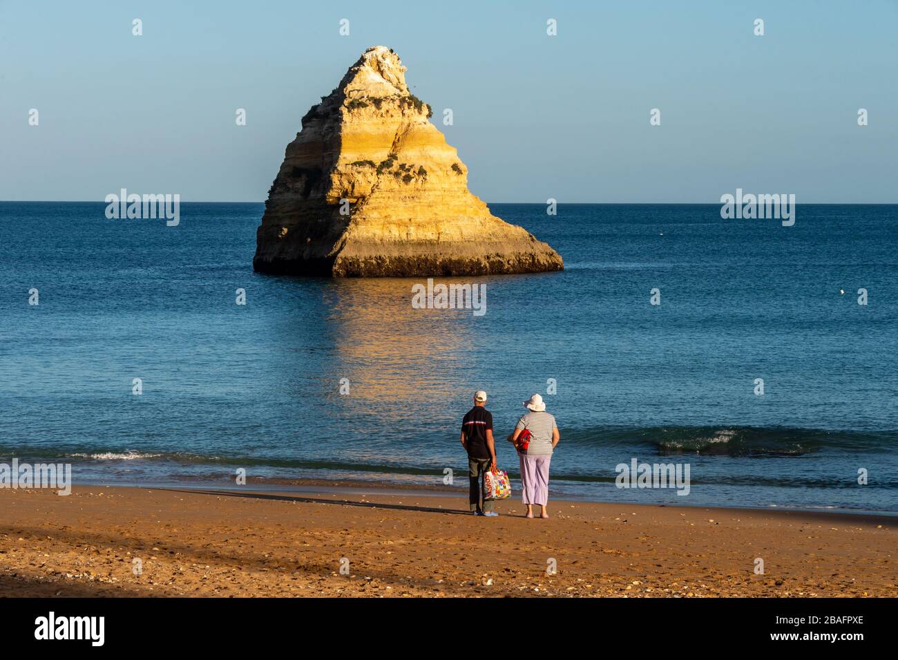Lagos, Portugal - 4 March 2020: Senior couple looking at the view from Dona Ana Beach Stock Photo