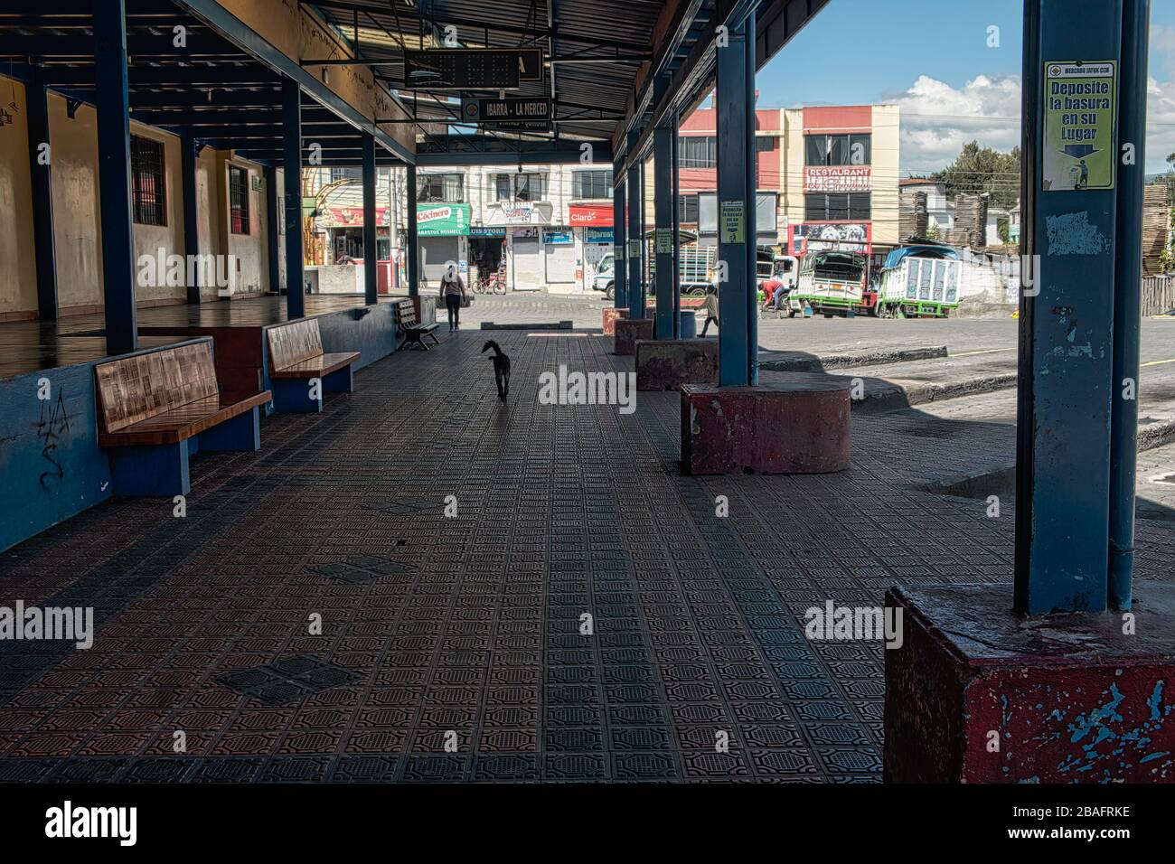 Coronavirus leaves Cotacachi bus station deserted. Sun shines on empty bus bays and shuttered shops Stock Photo