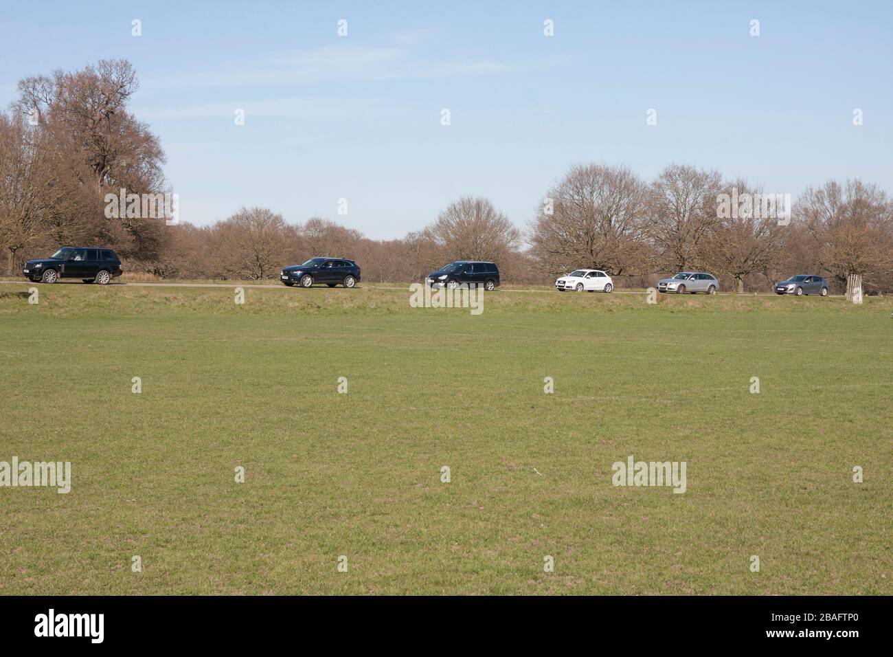 line of cars in Richmond Park, London, during the coronavirus outbreak 2020, just prior to gates closing, Mothers Day Stock Photo