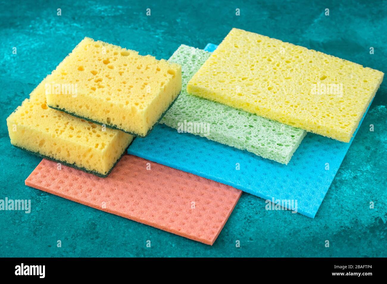 Kitchen dishcloth, cleanup concept, housework. Colorful kitchen sponges for cleaning close-up, housekeeping Stock Photo