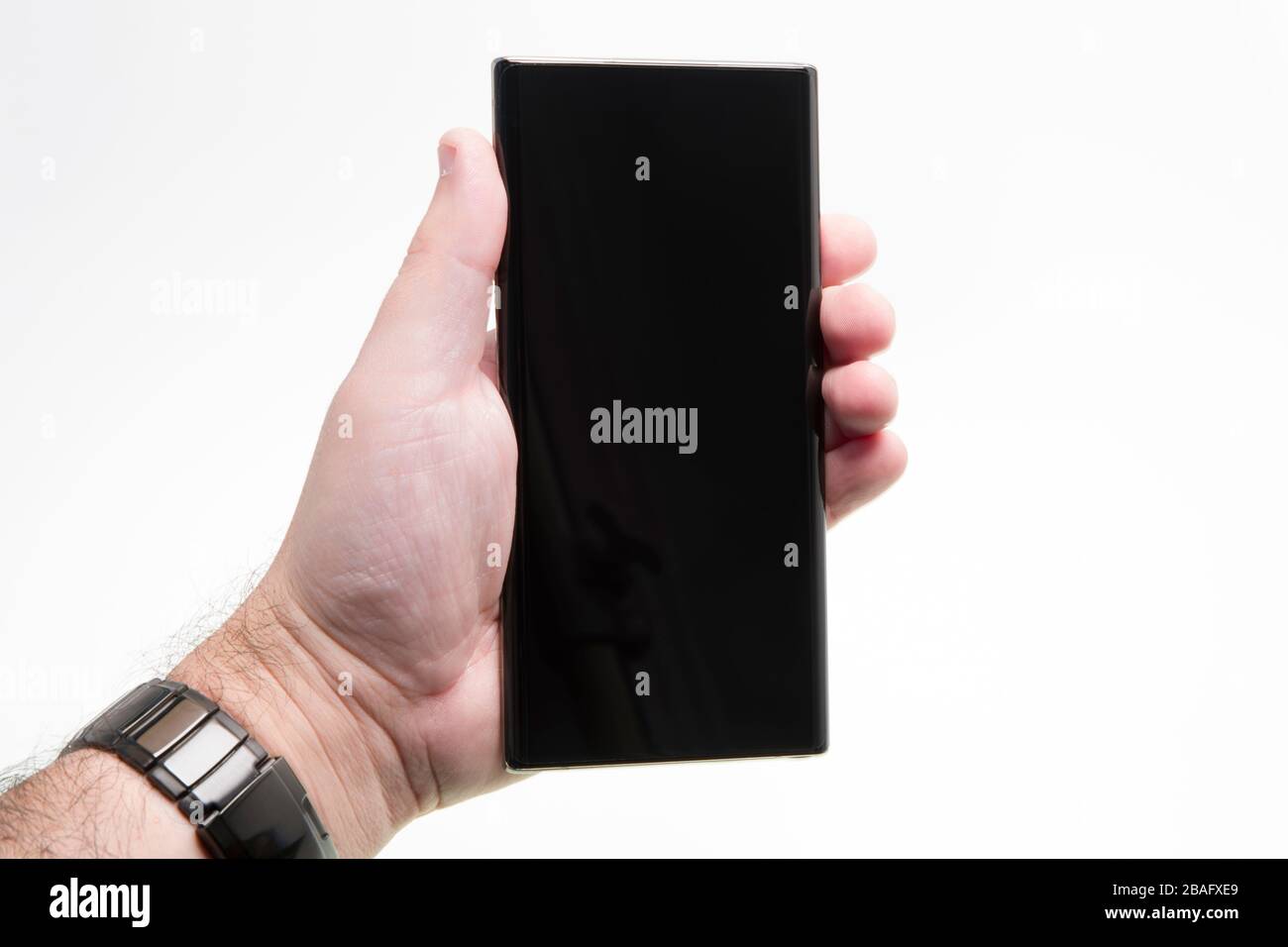 Hand held generic phone over white, black smartphone Stock Photo - Alamy