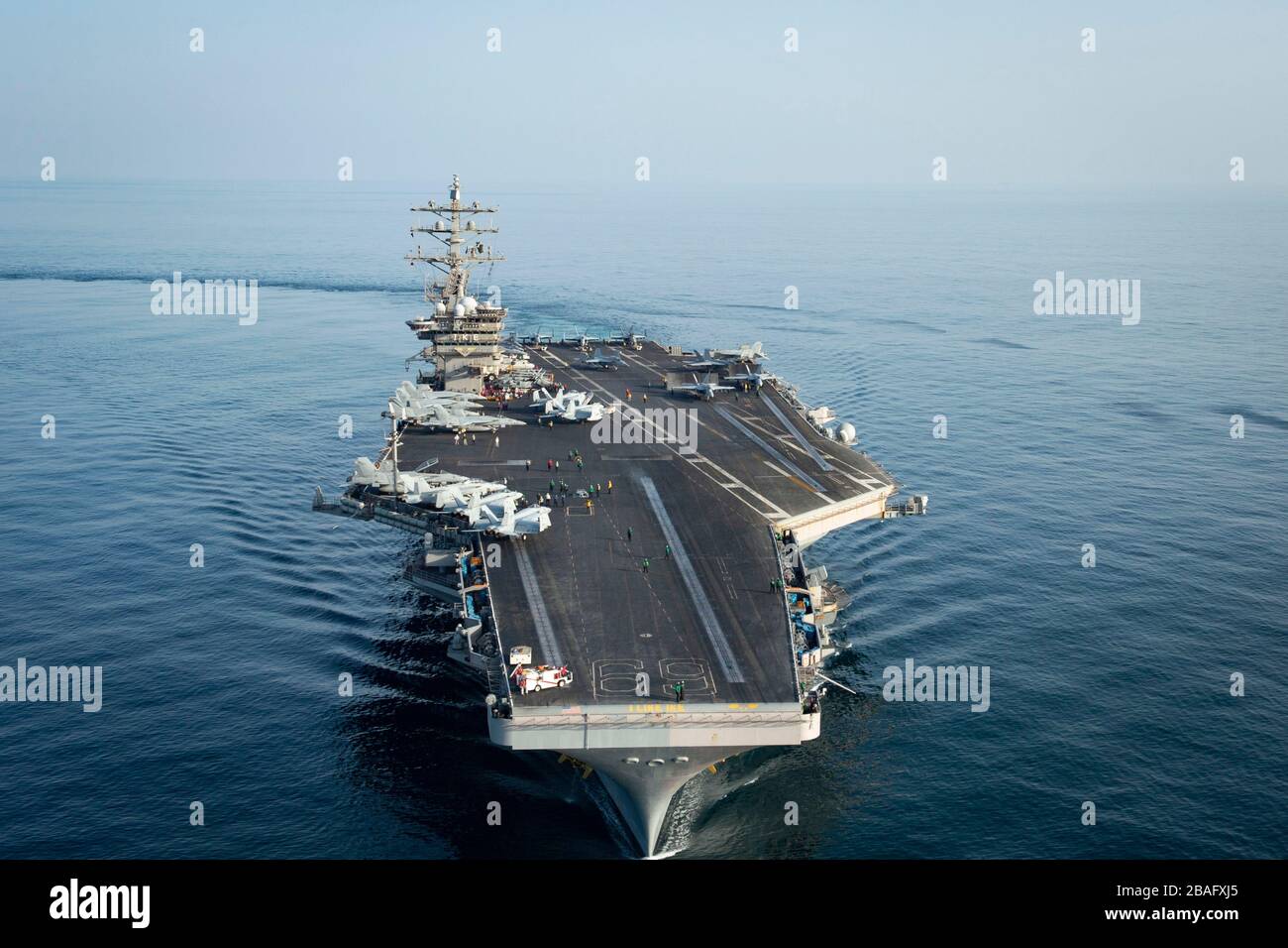 The U.S. Navy Nimitz-class aircraft carrier USS Dwight D. Eisenhower during a transit March 18, 2020 in the Arabian Sea. Stock Photo