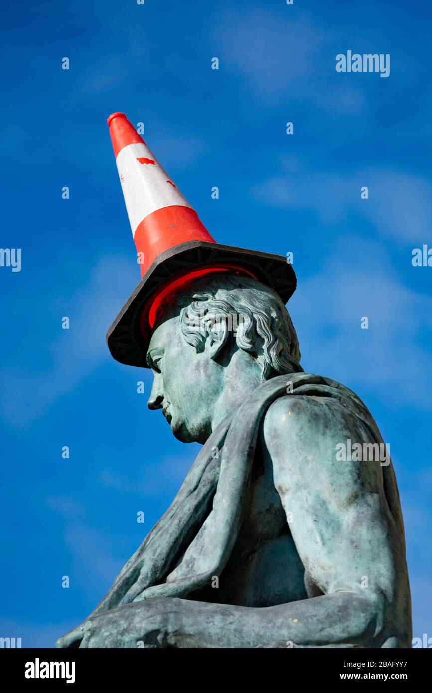 Traffic cone on head of David Hume statue on Royal Mile in Edinburgh, Scotland, UK Stock Photo