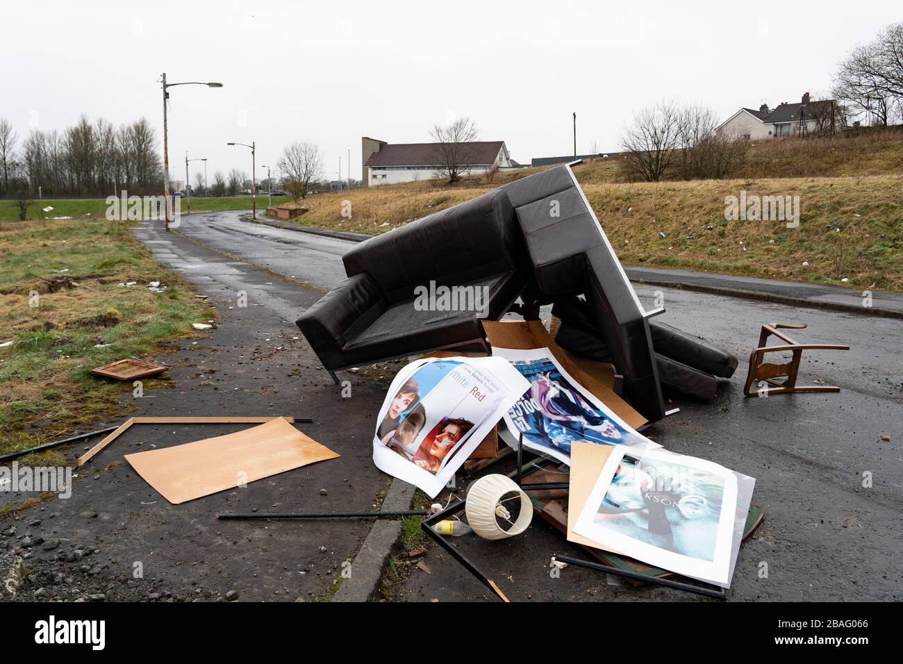 Fly tipping of household goods on street in Easterhouse in Glasgow, Scotland UK Stock Photo