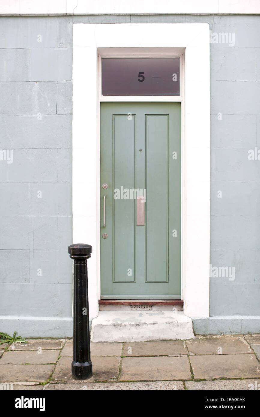 Colourful (colorful) front doors on homes/ houses in a residential urban city/ town street in Britain. Stock Photo