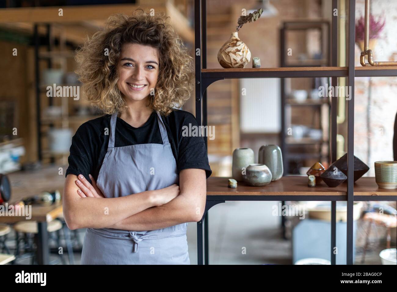 Portrait of woman pottery artist in art studio Stock Photo - Alamy