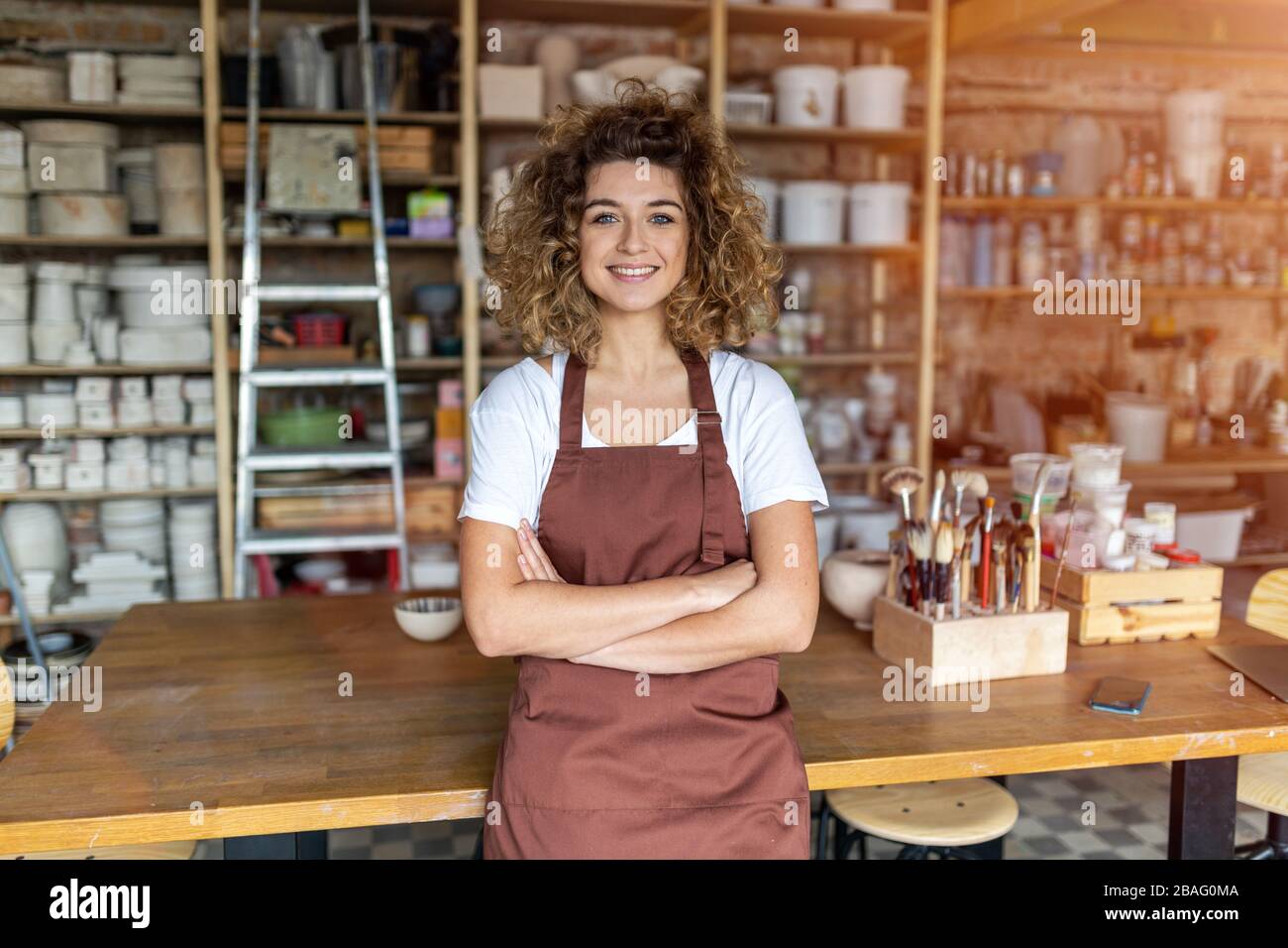 Portrait of woman pottery artist in art studio Stock Photo - Alamy