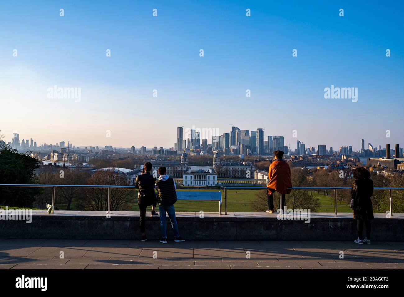 Social distance exercising in Greenwich Park.  View of the City of London. Stock Photo