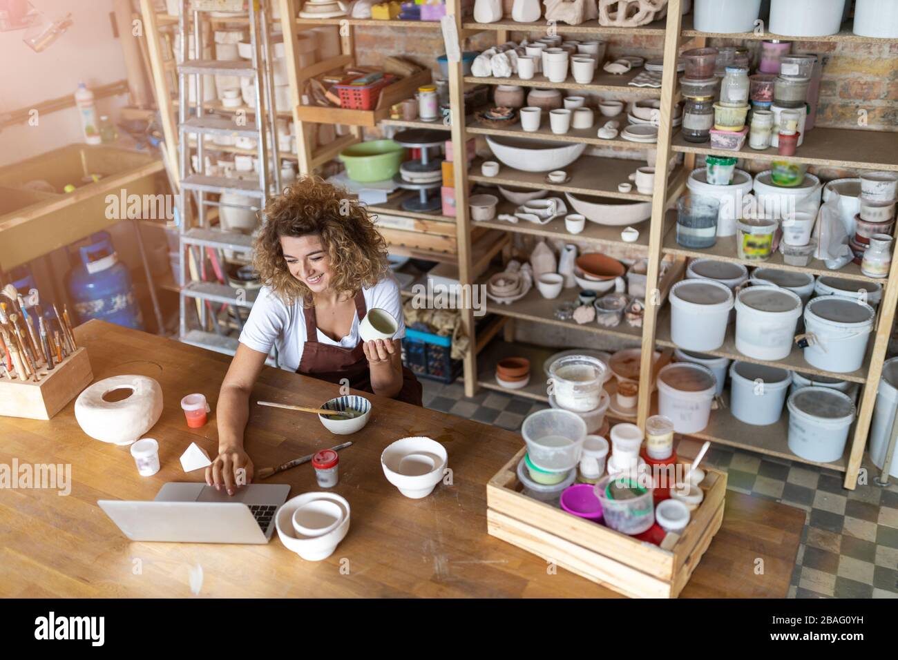 Portrait of woman pottery artist in art studio Stock Photo - Alamy