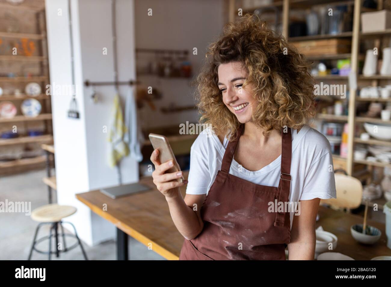 Portrait of woman pottery artist in art studio Stock Photo - Alamy