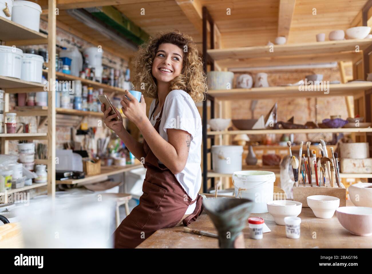 Portrait of woman pottery artist in art studio Stock Photo - Alamy
