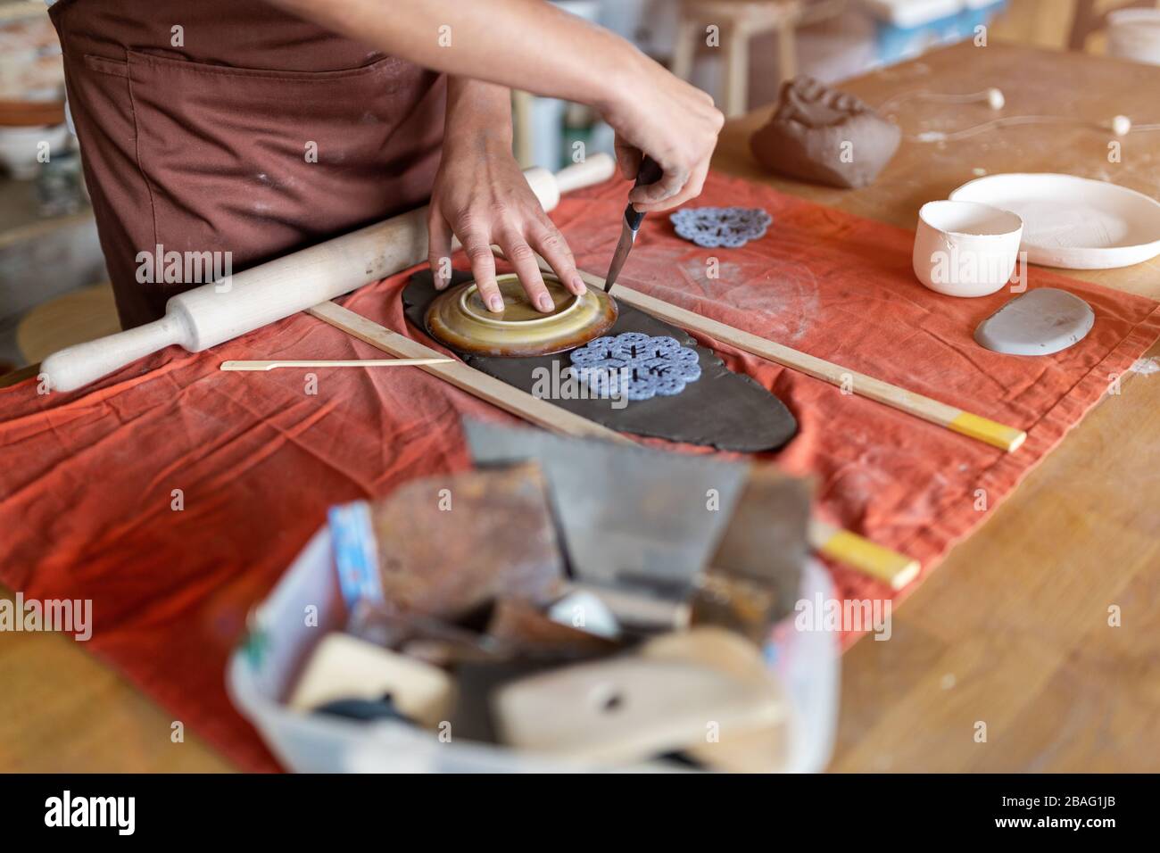 Portrait of woman pottery artist in art studio Stock Photo - Alamy