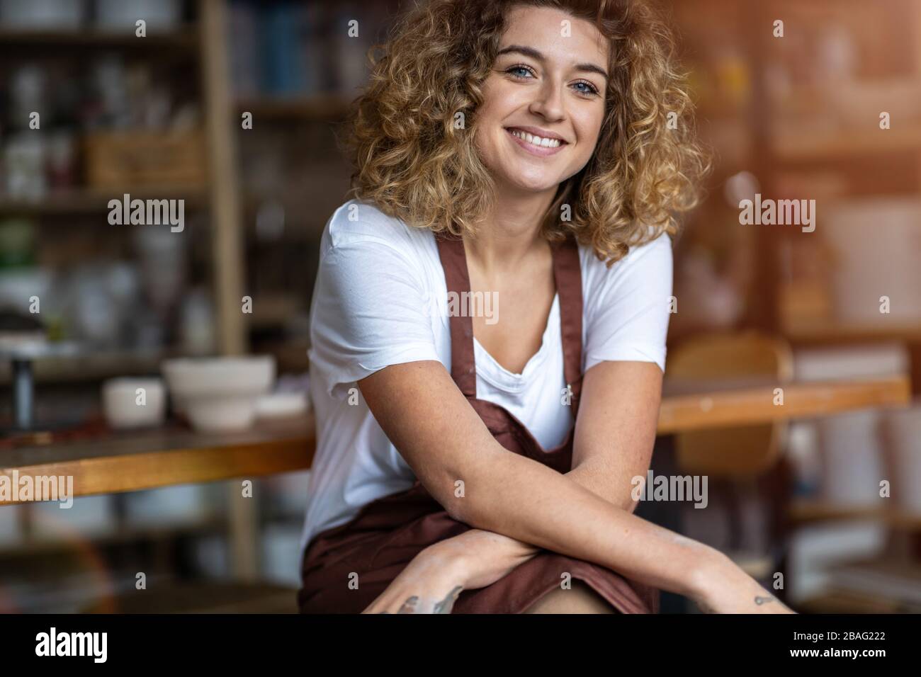 Portrait of woman pottery artist in art studio Stock Photo - Alamy