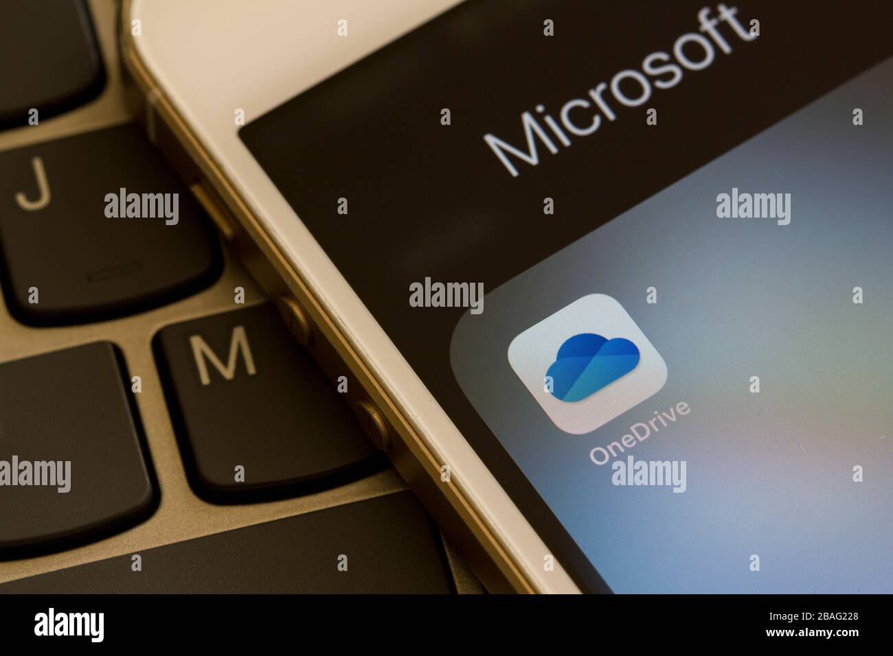 Microsoft OneDrive mobile app icon is seen on a smartphone. OneDrive is Microsoft's personal cloud storage service solution for file hosting. Stock Photo