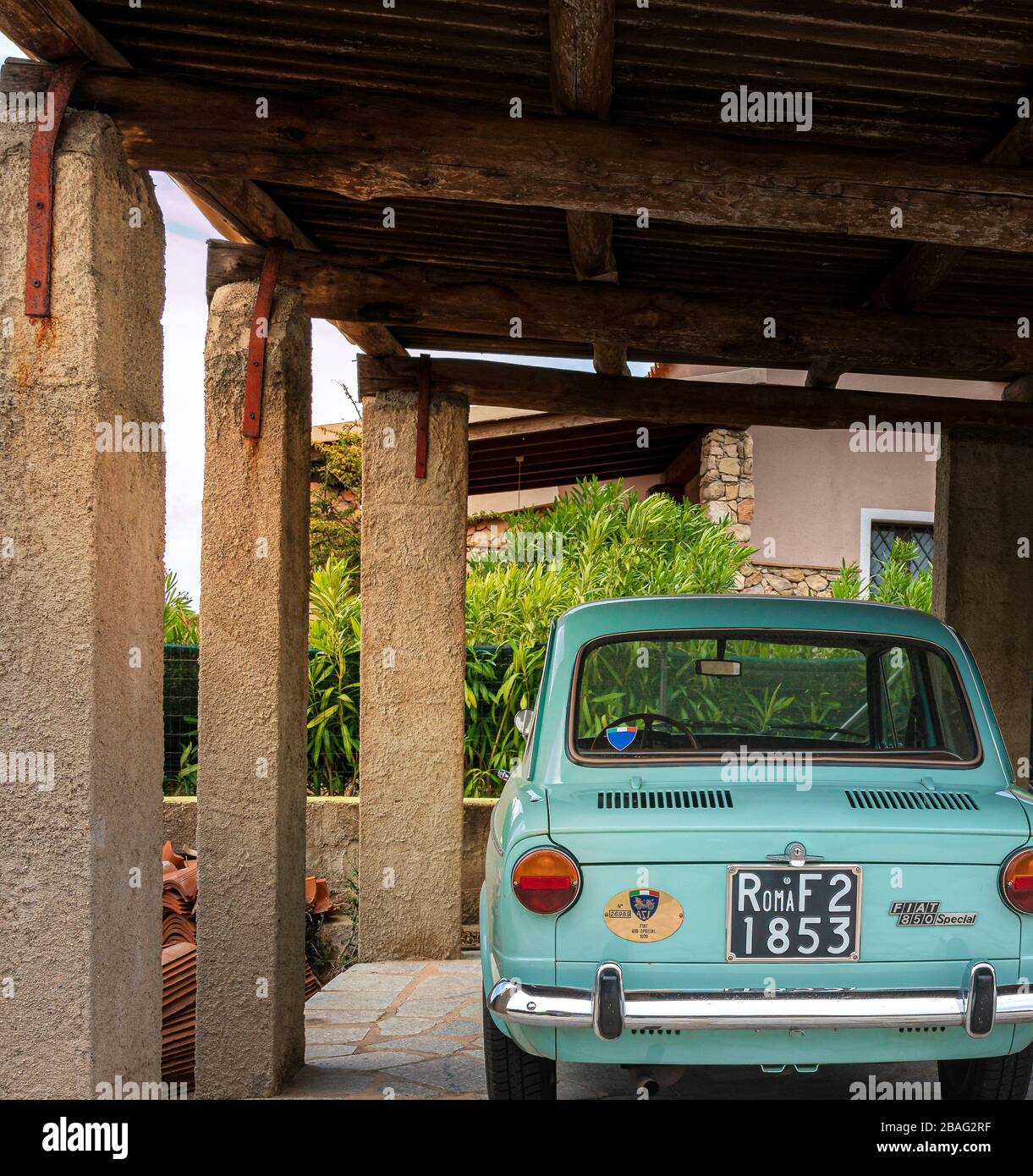 Sardinia; Italy; an old fiat 850 of the special edition roma stands in a garage on the island Stock Photo