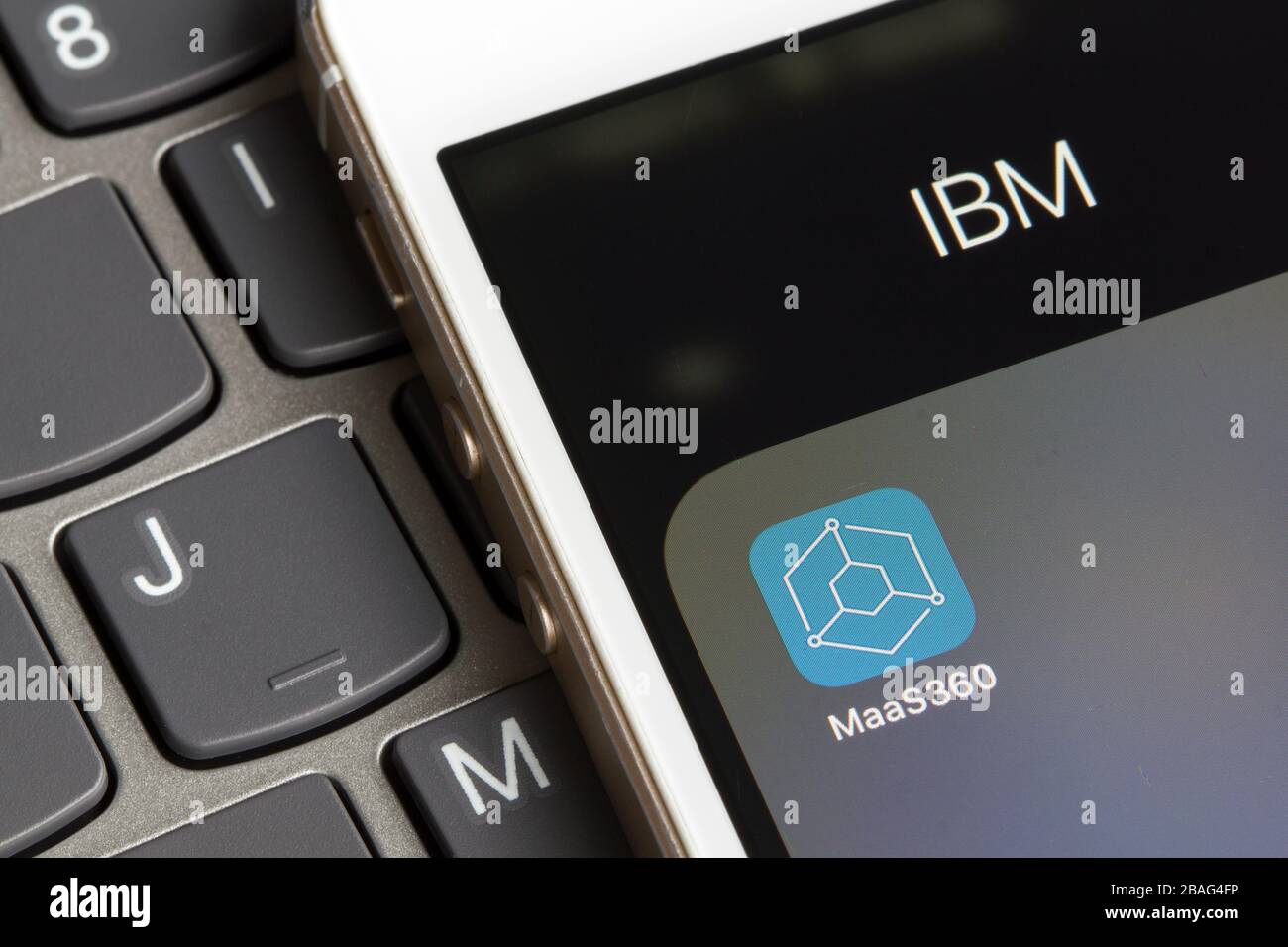IBM MaaS360 mobile app icon closeup. MaaS360 with Watson is a cloud-based MDM software that securely enables mobile devices to access corporate data. Stock Photo