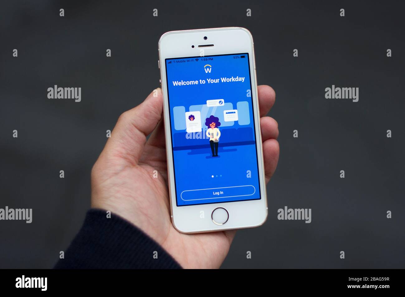 Workday mobile app login screen seen on a smartphone in user's hand. It provides mobile access to Workday cloud platform enterprise-class applications. Stock Photo