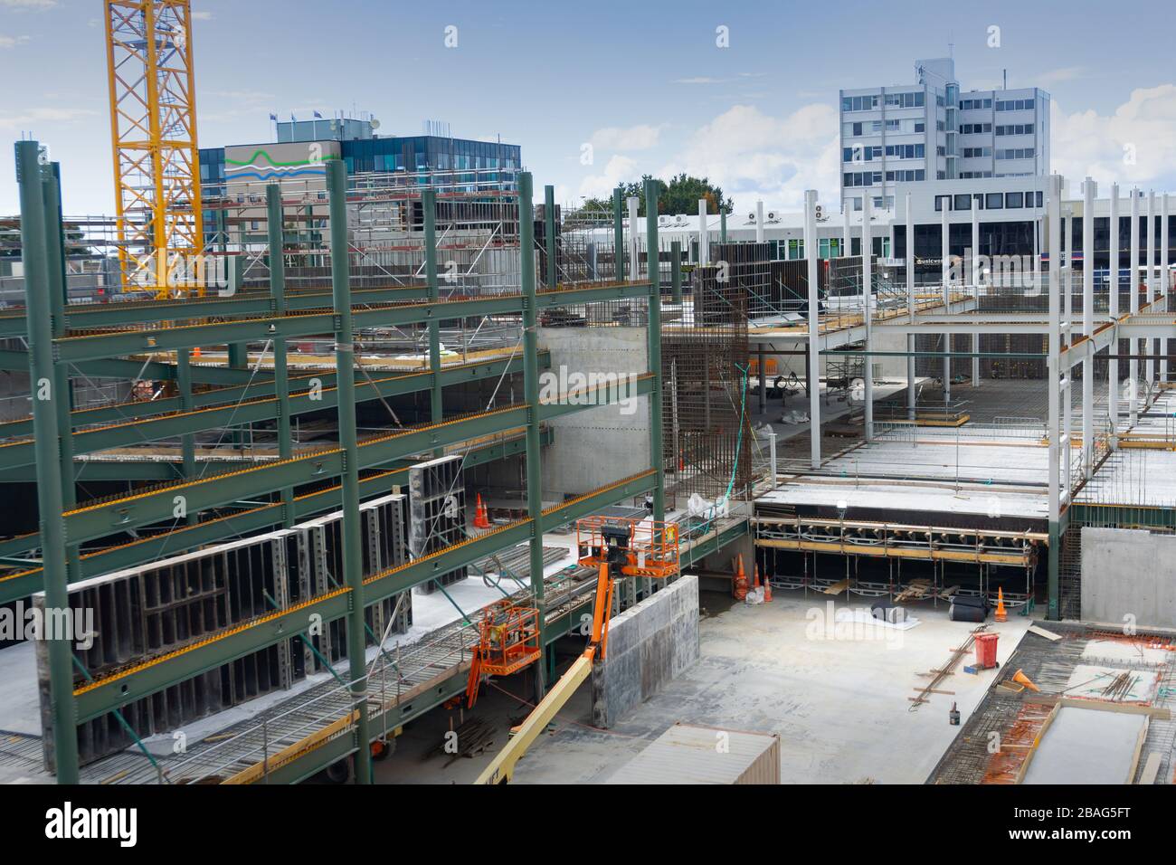 Tauranga New Zealand - March 27 2020; City construction site deserted of workers during covid-19 pandemic crisis with equipment and partly built build Stock Photo