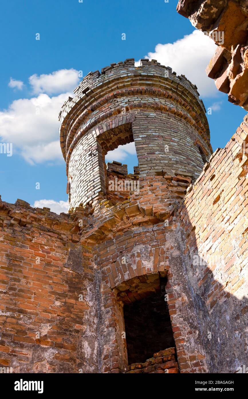 ruins of old tower on blue sky background Stock Photo - Alamy