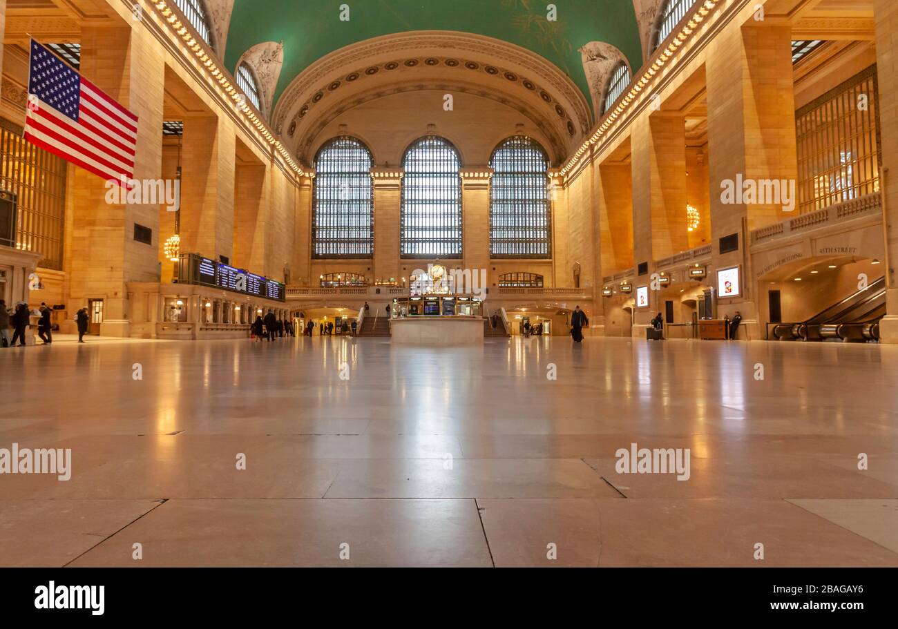 Very few passengers in Grand Central Station in New York City because of COVID-19, Coronavirus. Stock Photo