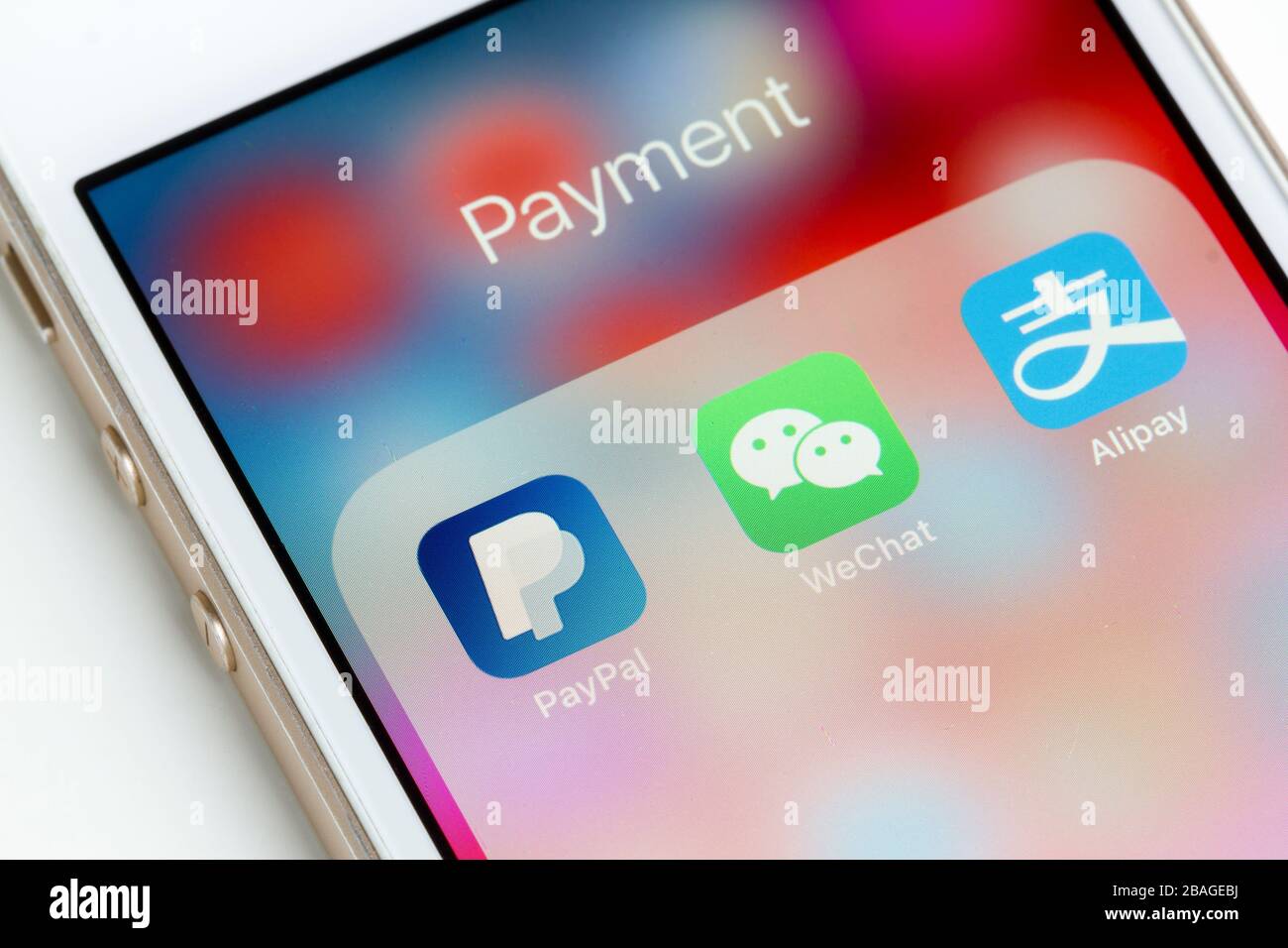 PayPal, WeChat Pay and Alipay mobile app icons are seen on a smartphone. Stock Photo