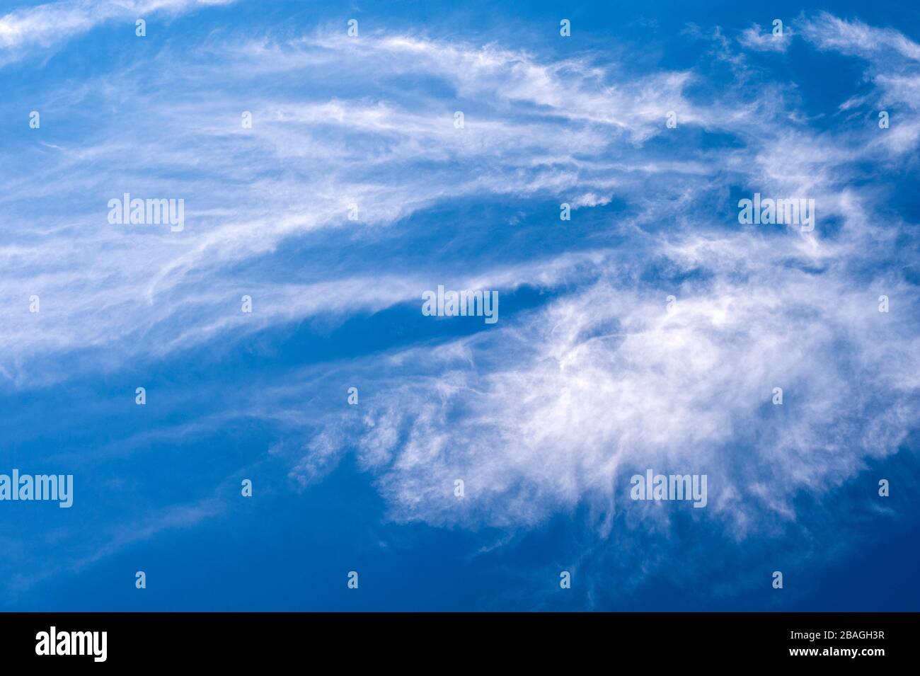 Cirrus clouds in deep blue sky with nature patterns. Stock Photo