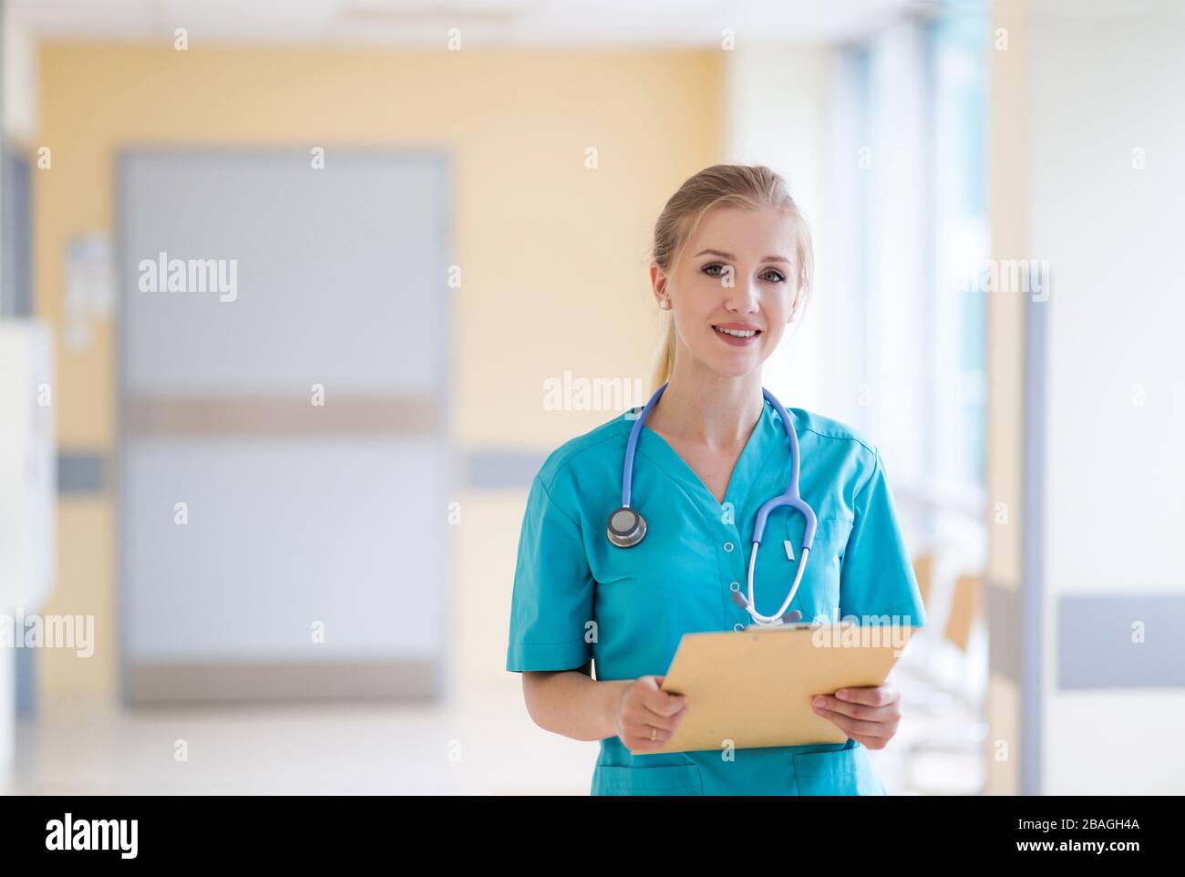 Young friendly smiling nurse hi-res stock photography and images - Alamy