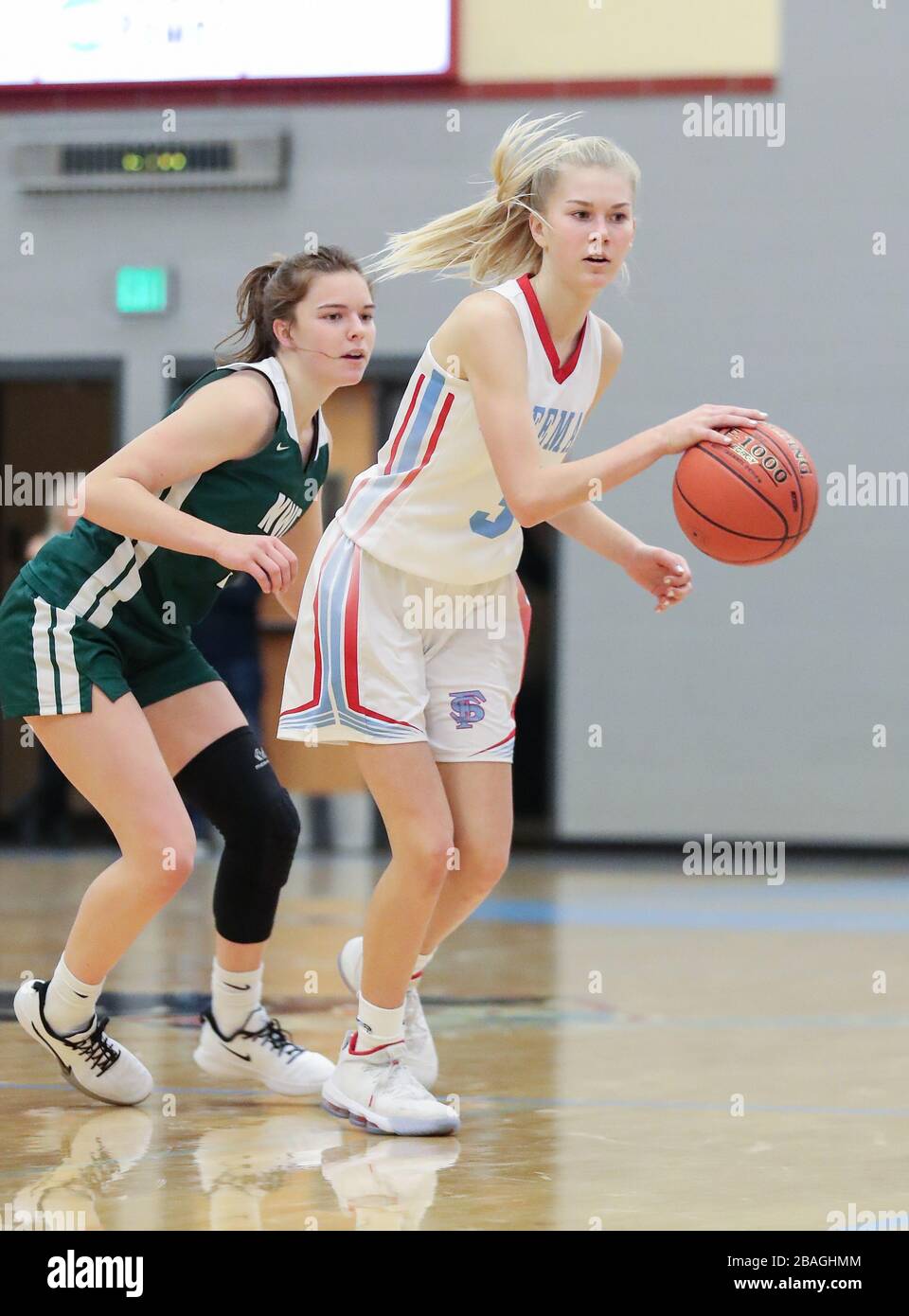 Basketball action with Northwest Christian vs Freeman High School in