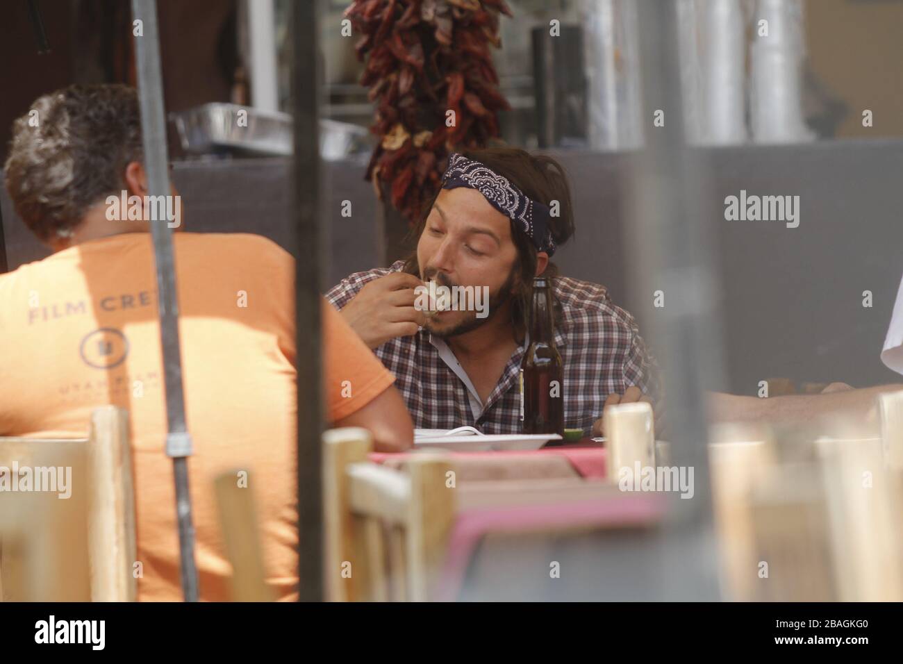 Diego luna comiendo tacos y bebiendo  en una comida  durante una  fiesta privada en restaurante mexicano en Hemosillo Sonora acompañado con el directo Stock Photo