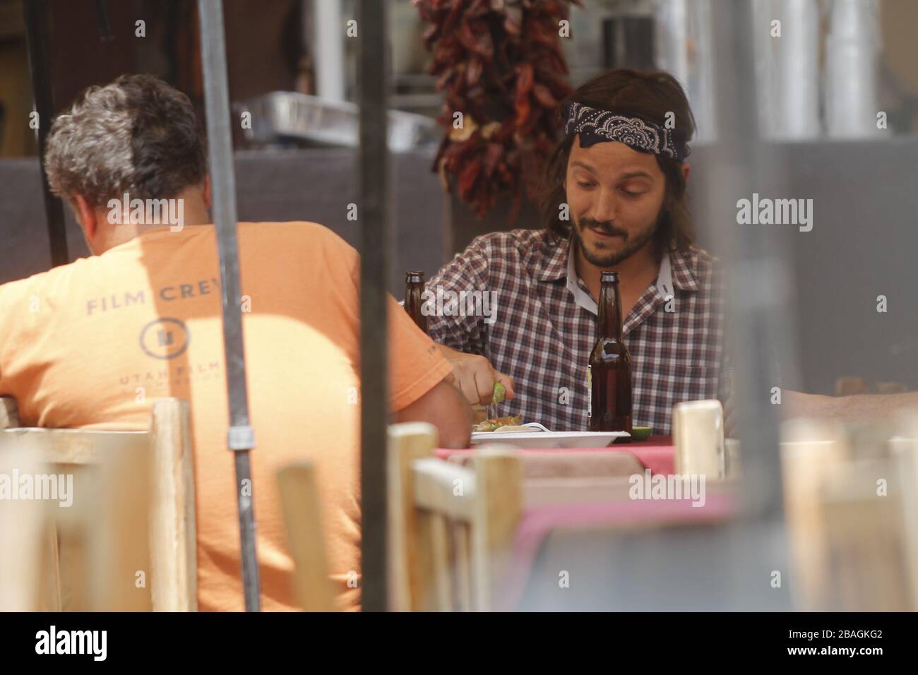 Diego luna comiendo tacos y bebiendo  en una comida  durante una  fiesta privada en restaurante mexicano en Hemosillo Sonora acompañado con el directo Stock Photo