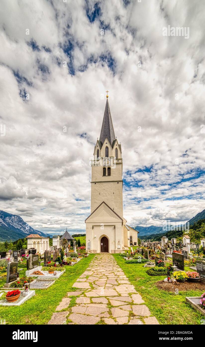 Feistritz an der Gail (VL), Osterreich,  - AUGUST 14, 2019: clouds are covering the sky over the Parish Church dedicated to Saint Martin Stock Photo