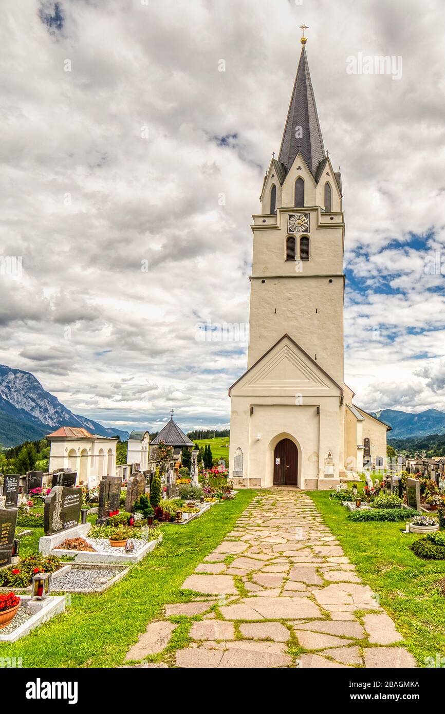 Feistritz an der Gail (VL), Osterreich,  - AUGUST 14, 2019: clouds are covering the sky over the Parish Church dedicated to Saint Martin Stock Photo