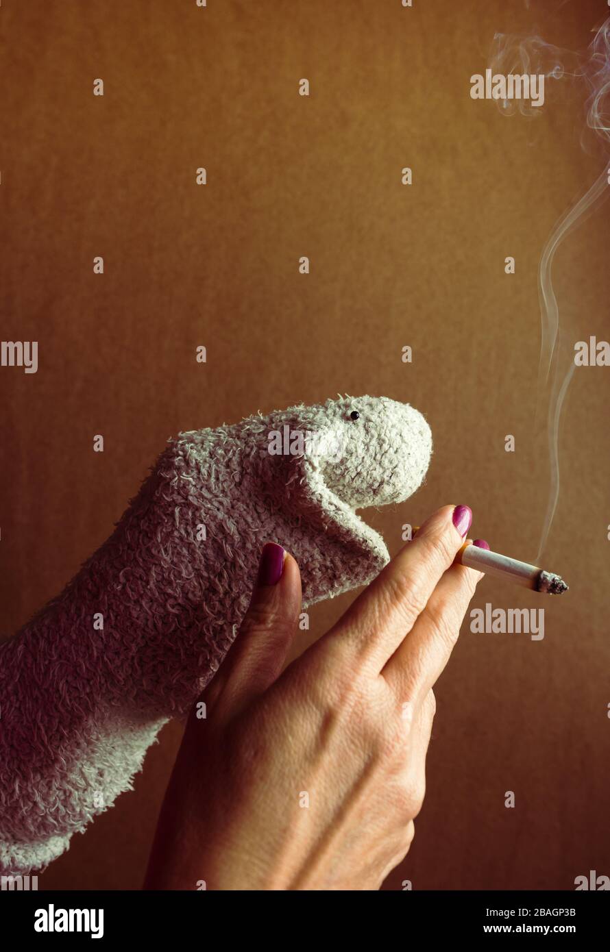 Dummy made of sock, he's smoking a cigarette. Campaign to prevent smoking Stock Photo